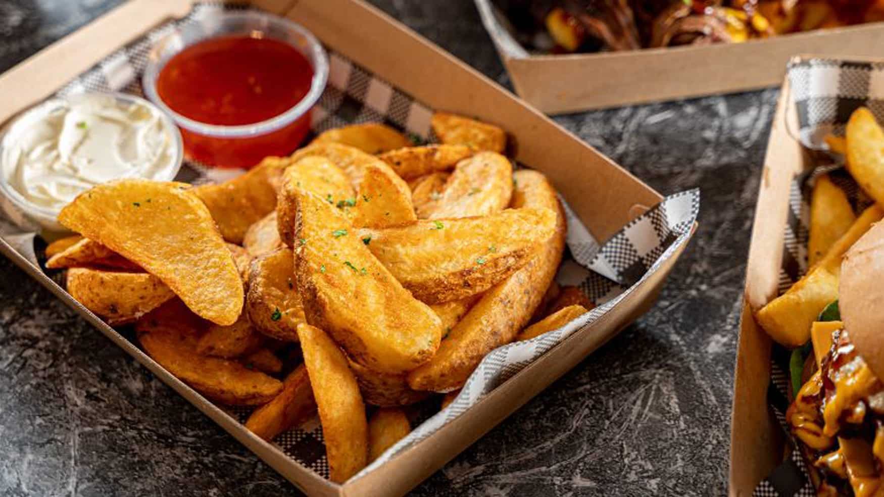Potato wedges with dipping sauces