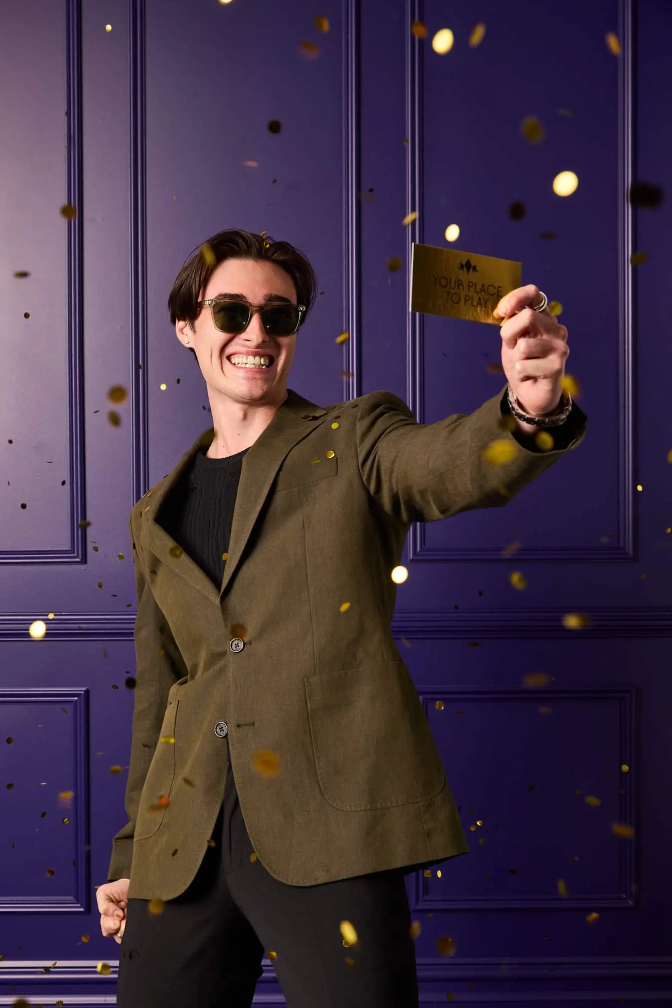 Person holding a card with confetti.