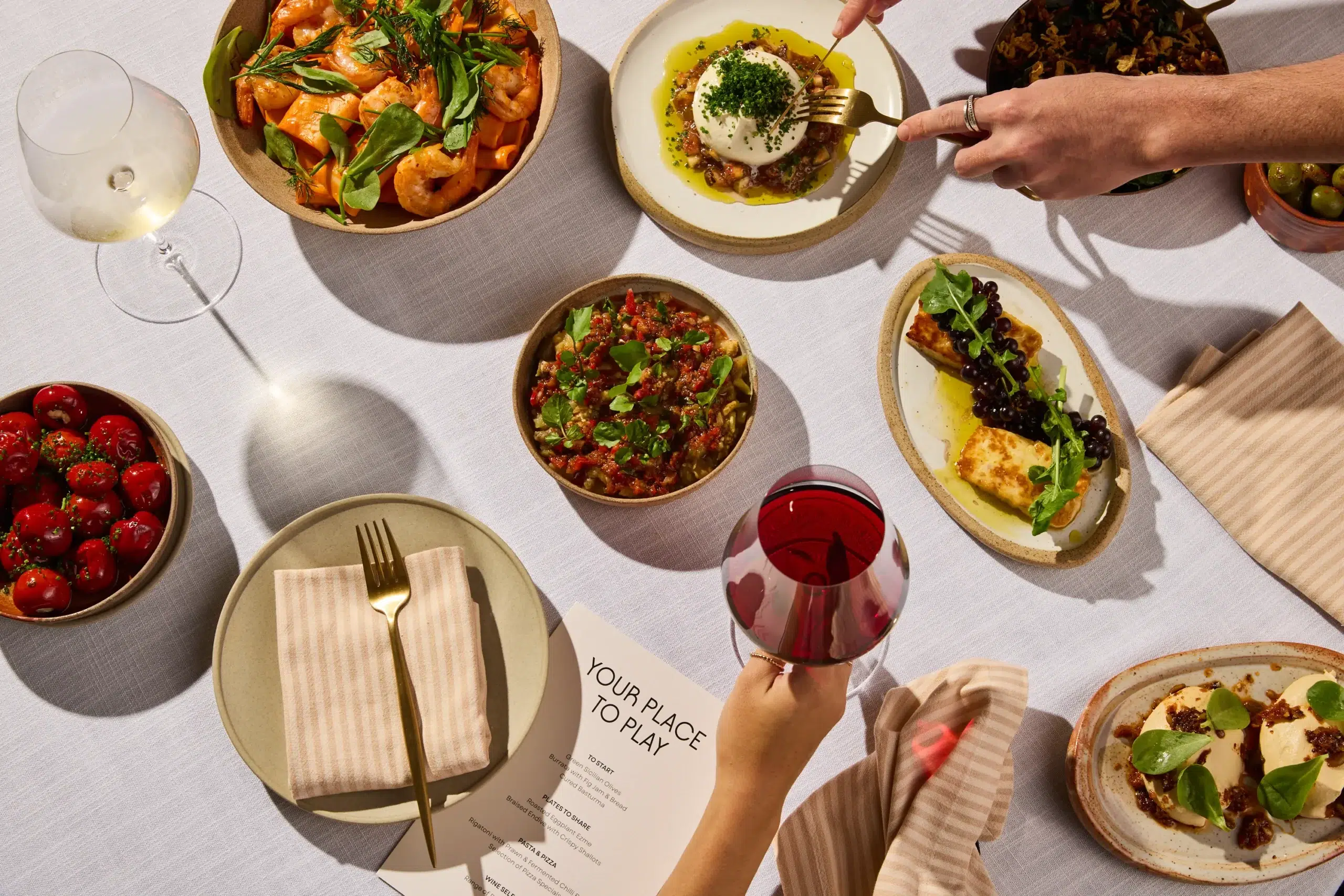 Colorful dishes on a dining table.