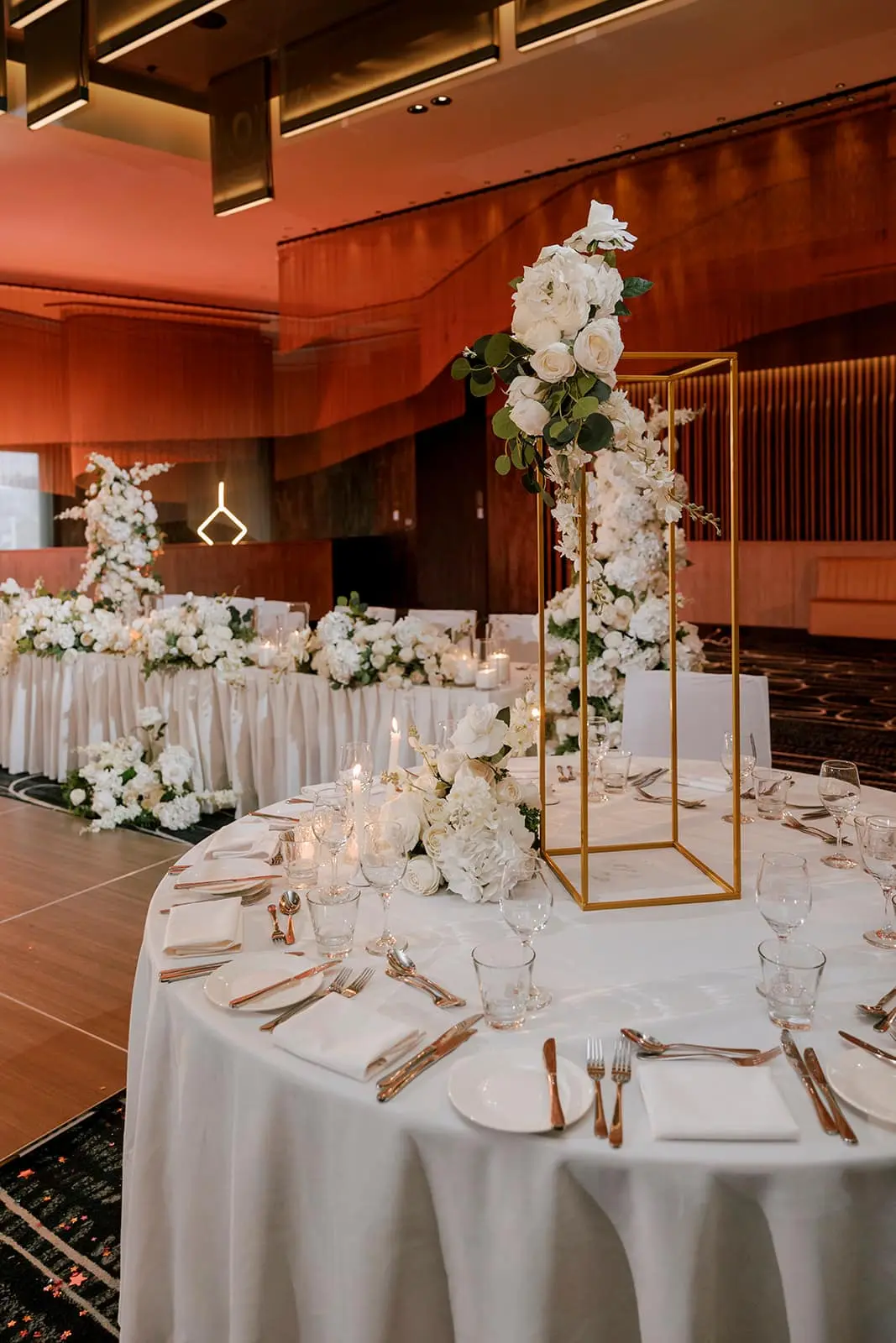 Elegant floral wedding reception setup.