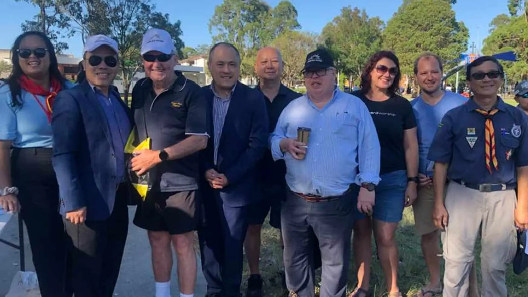 Community leaders and volunteers gather at Clean Up Australia Day in Cabramatta, showing unity.