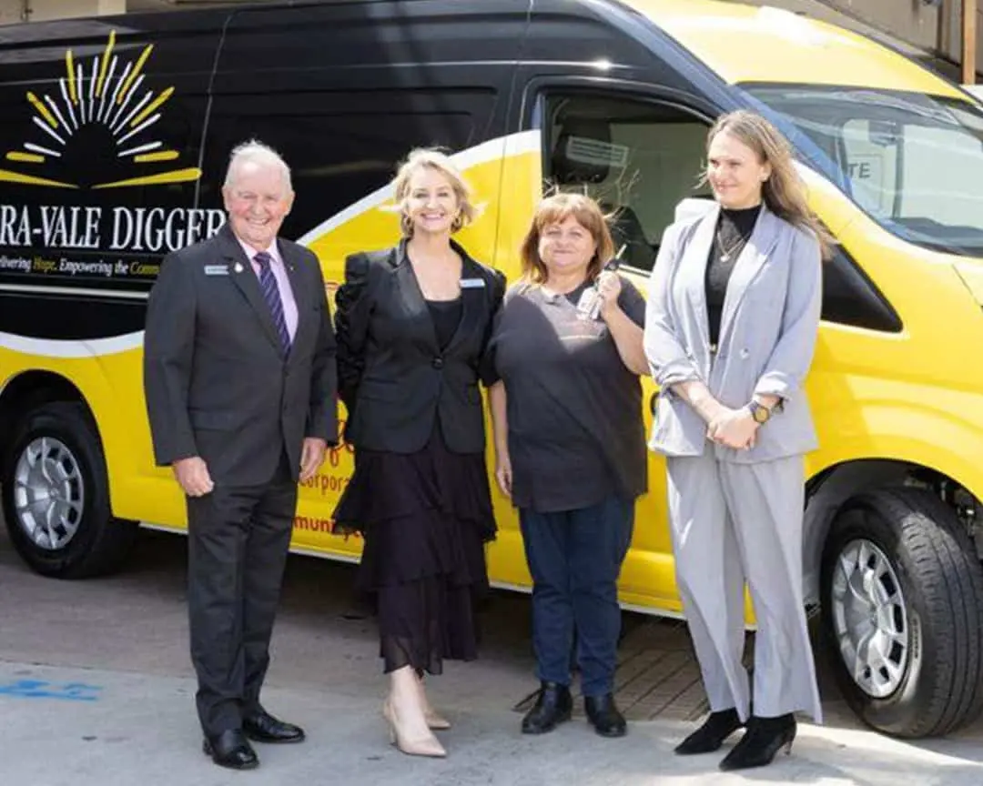 Cabravale Club Resort representatives present a donated community van to Community Café Inc., supporting food delivery services for families in need