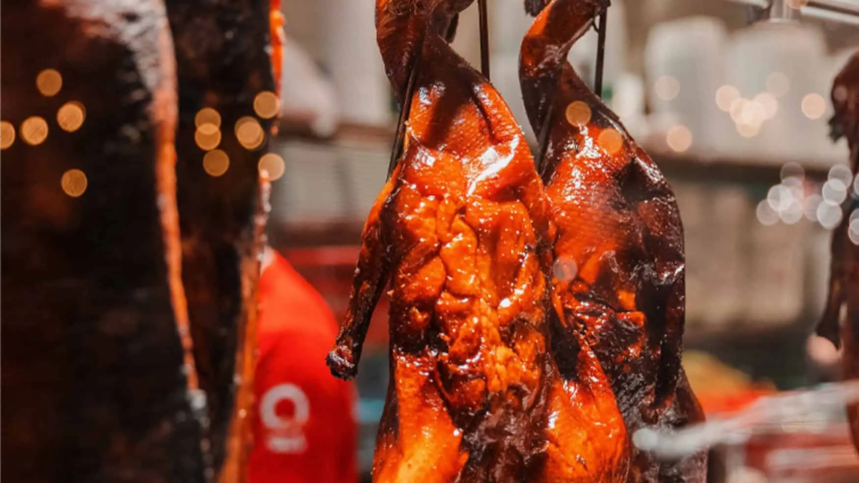 Roasted Peking duck hanging in display at District 8 dining at Cabravale Club Resort.