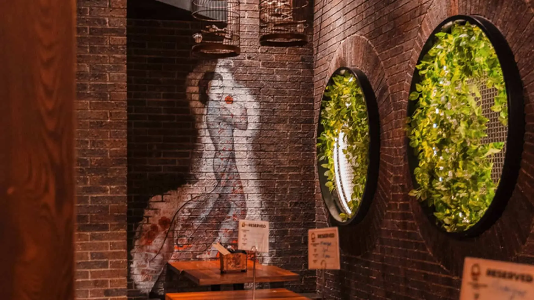 Wall mural of a woman holding a rose at District 8 dining venue in Canley Vale.