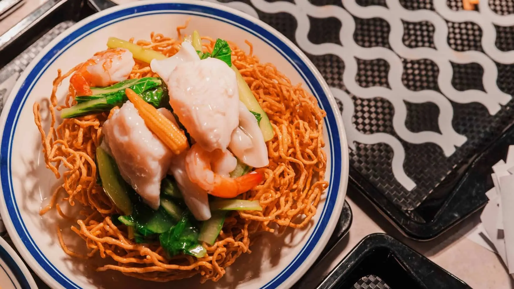 Crispy noodles topped with seafood and vegetables