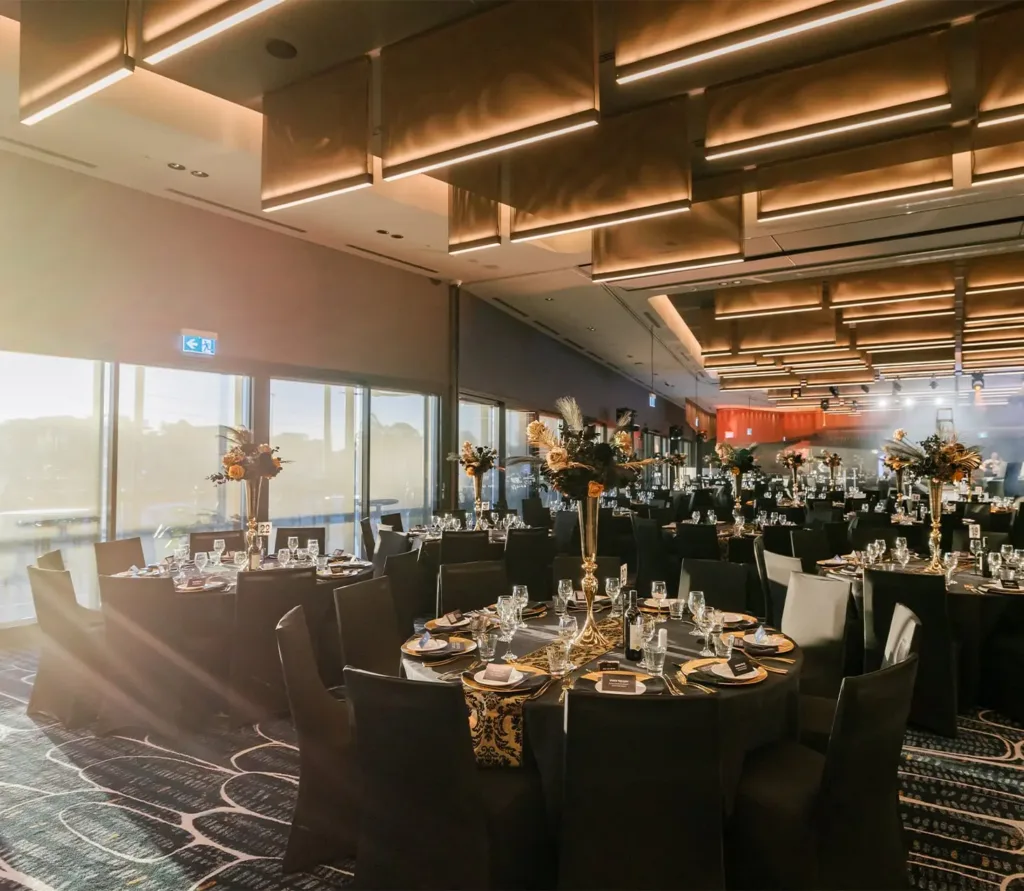 An End of Year Christmas party event held at Cabravale sydney venue using round table settings for over 100 people