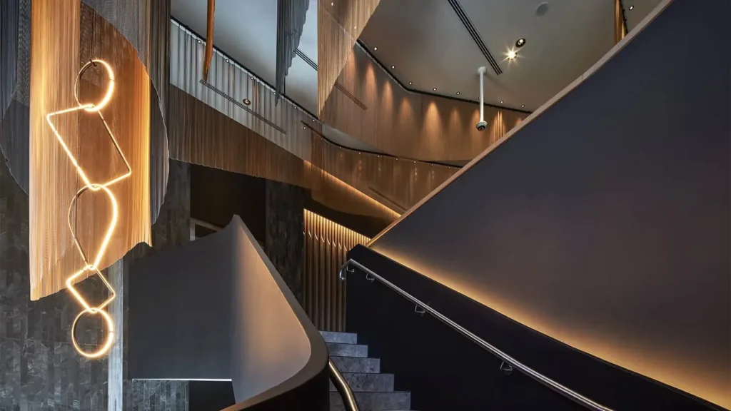 Sweeping staircase and sculptural light feature inside the Cabravale Events & Conference Centre