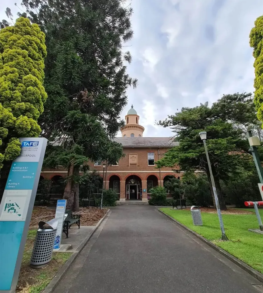 Entrance and heritage building at TAFE NSW Liverpool, surrounded by landscaped gardens and pathways near Cabravale.
