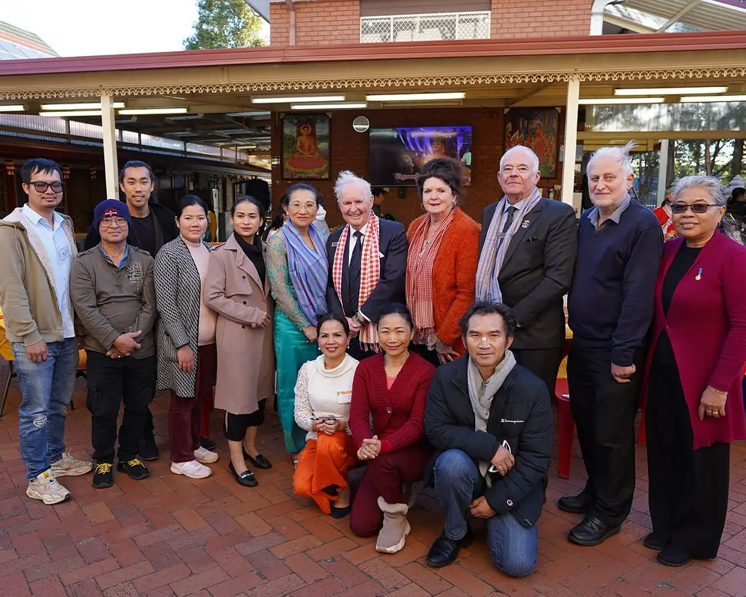 Group photo of community members and Cabravale Club Resort representatives at the Cambodian Temple in Bonnyrigg during the Kids in the Kitchen healthy eating program event.