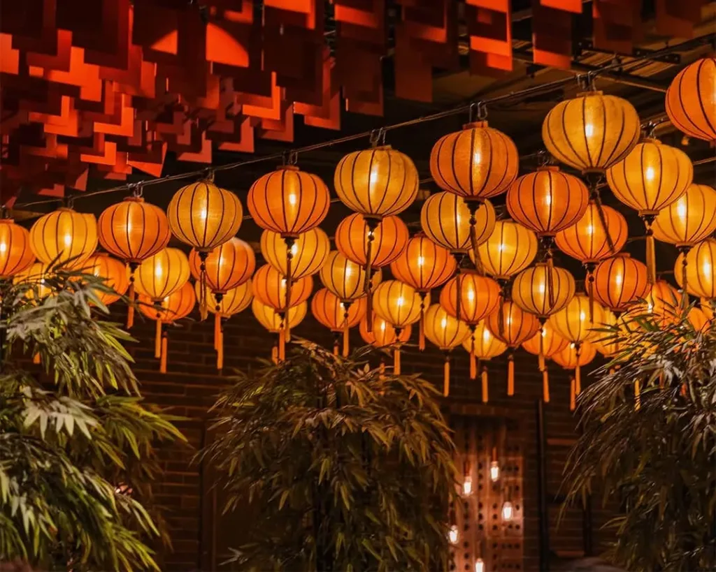 Warm lanterns hang above a private dining room, creating an intimate atmosphere for events at Cabravale Club Resort