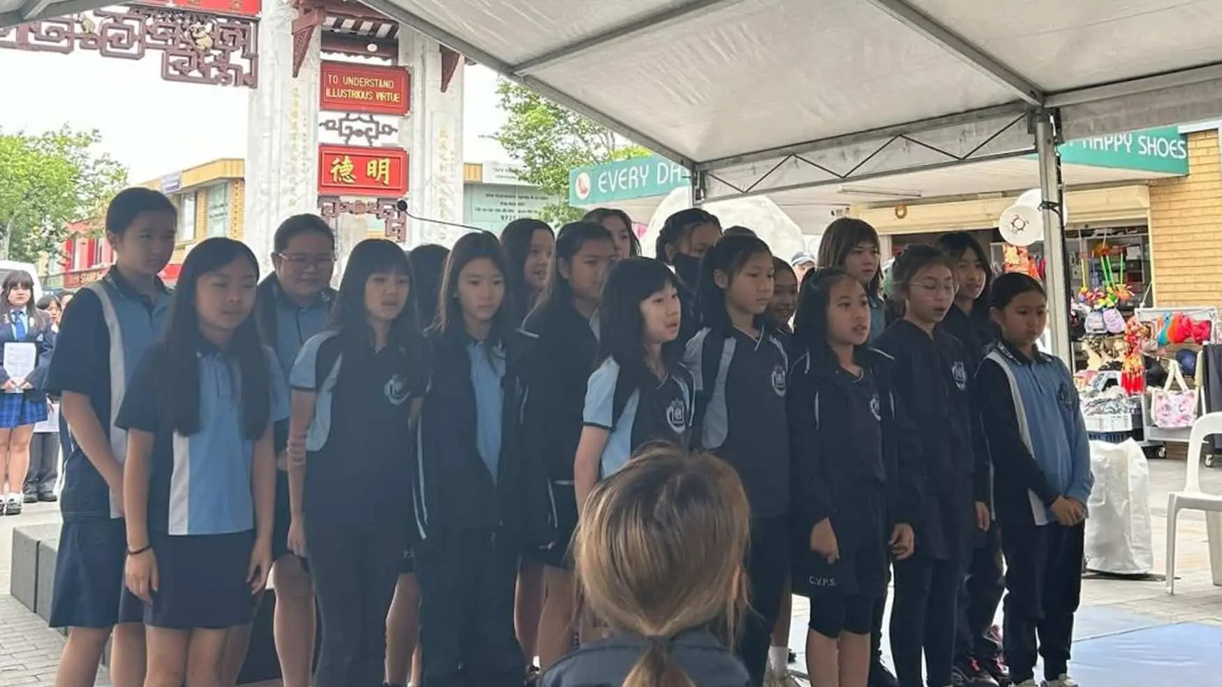 Students singing together in support of the Walk Against Domestic and Family Violence.