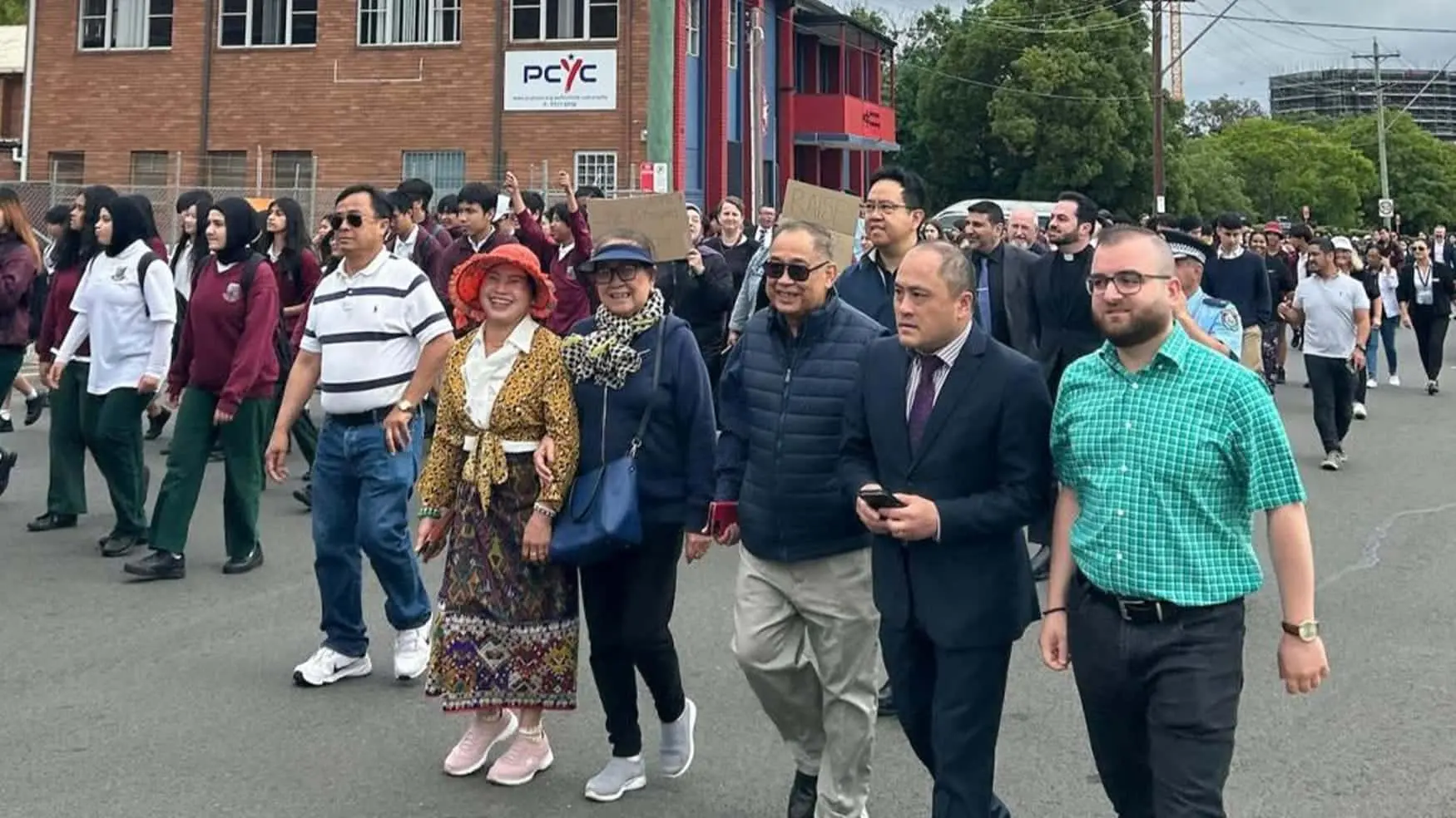 Community leaders, students and families march together in solidarity during the Walk Against Domestic and Family Violence.