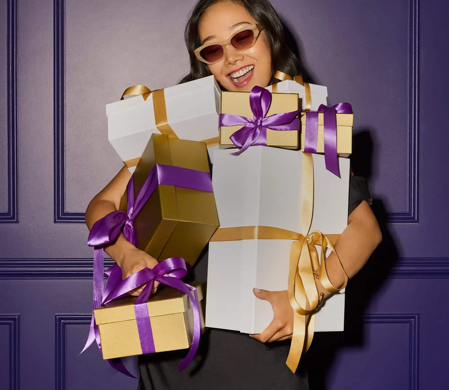 Smiling guest holding gift boxes at Cabravale Resort Club, representing exciting prizes, rewards, and winning experiences for members.