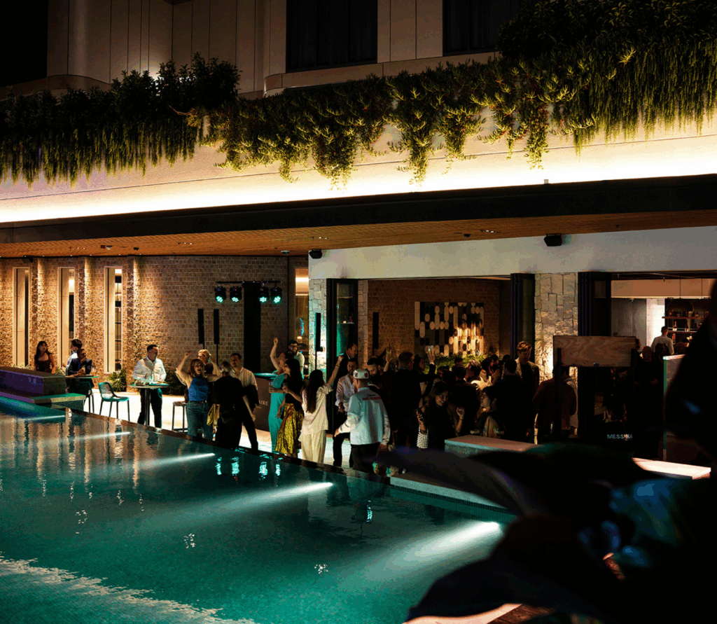 Evening crowd enjoying poolside drinks at Solaire Lounge, Cabravale Club Resort