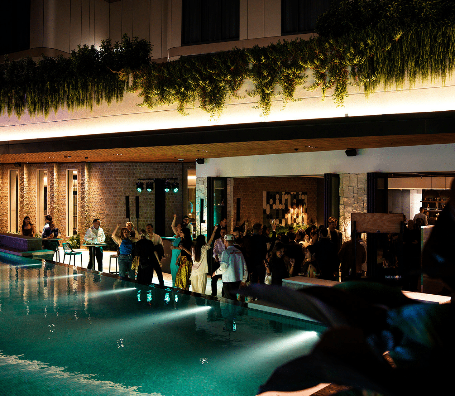 Evening crowd enjoying poolside drinks at Solaire Lounge, Cabravale Club Resort