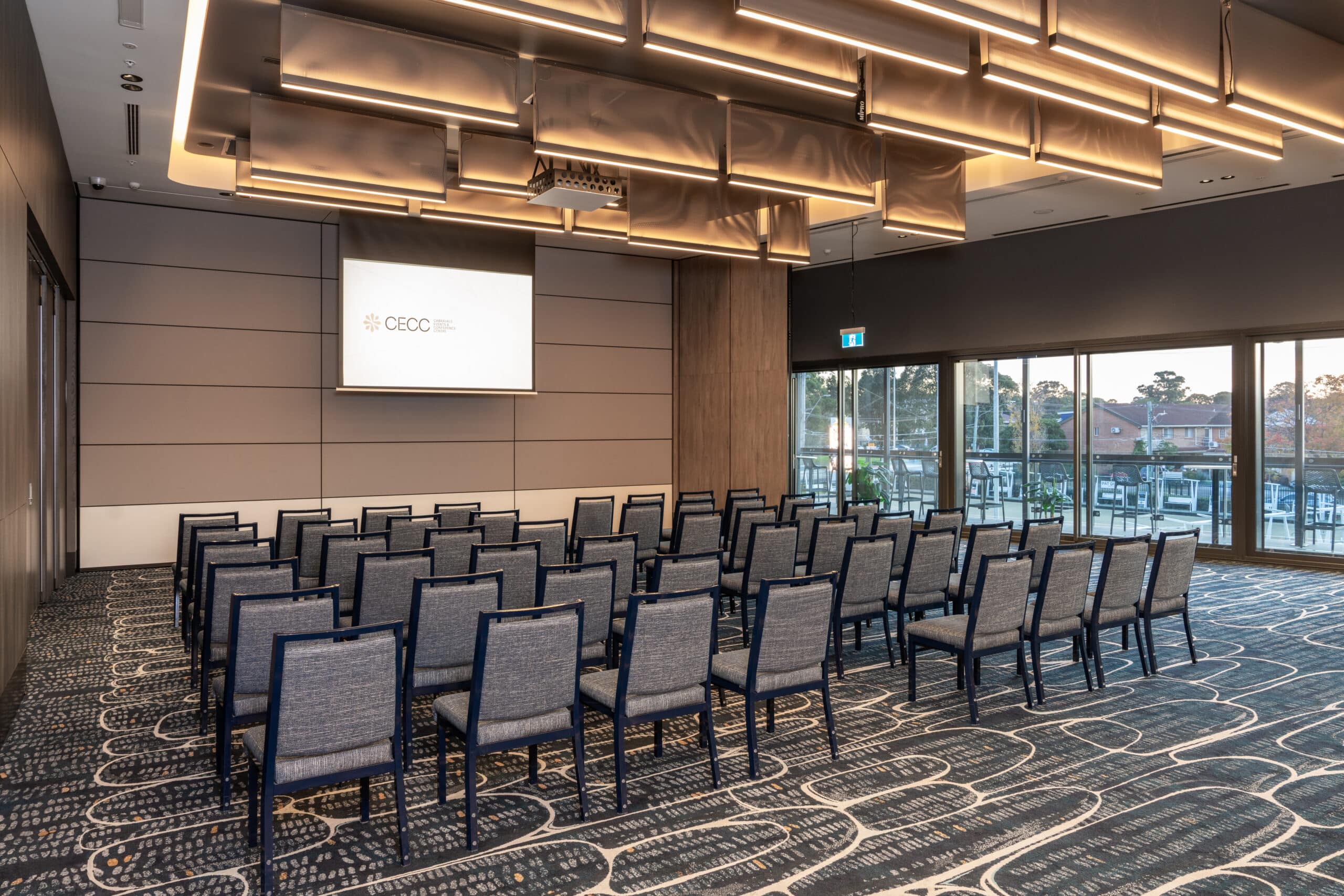 Theatre-style corporate event venue at Cabravale Club Resort, featuring modern seating, presentation facilities, and natural light, ideal for corporate events and training.