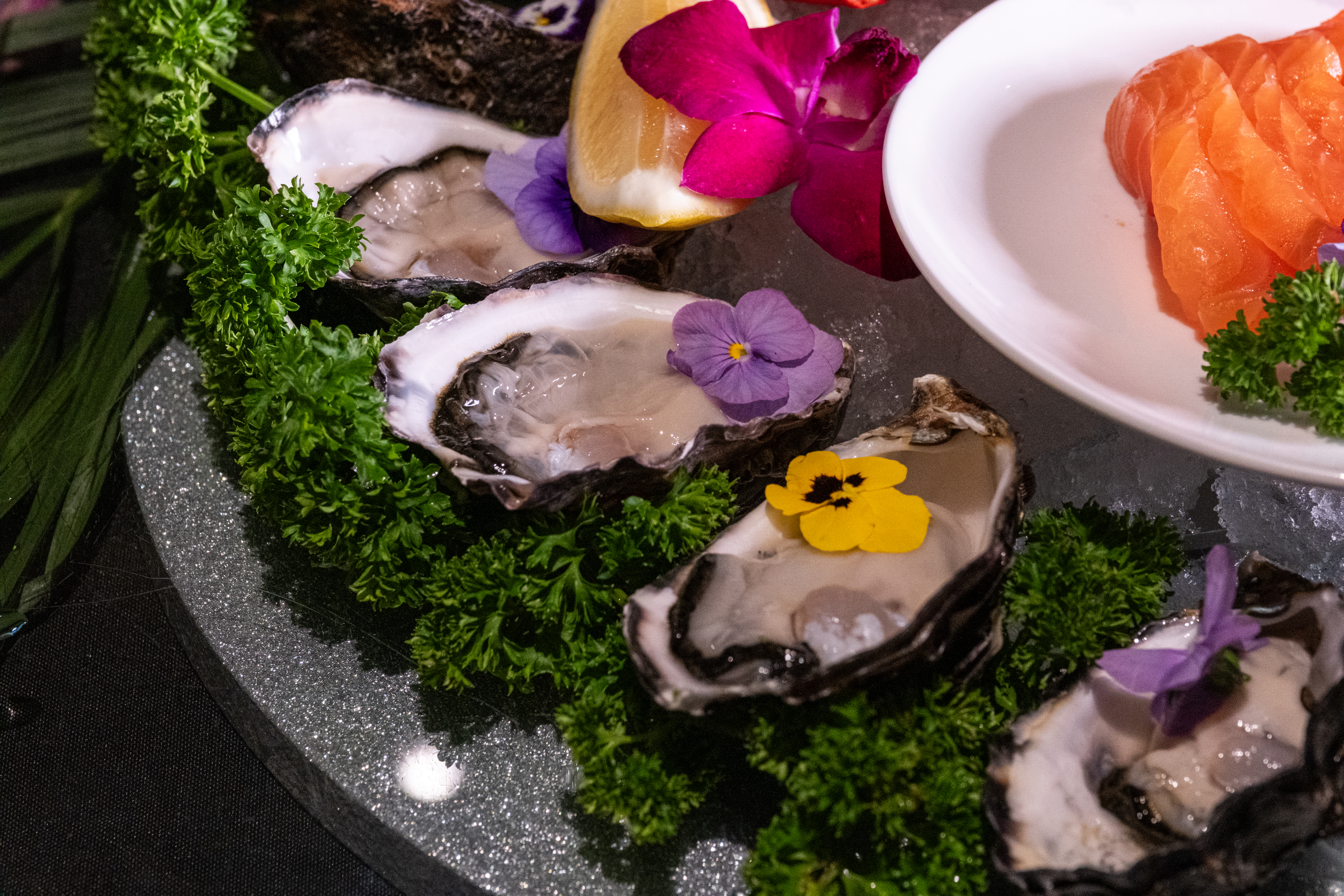 seafood buffet with crab, salmon sashimi and oysters