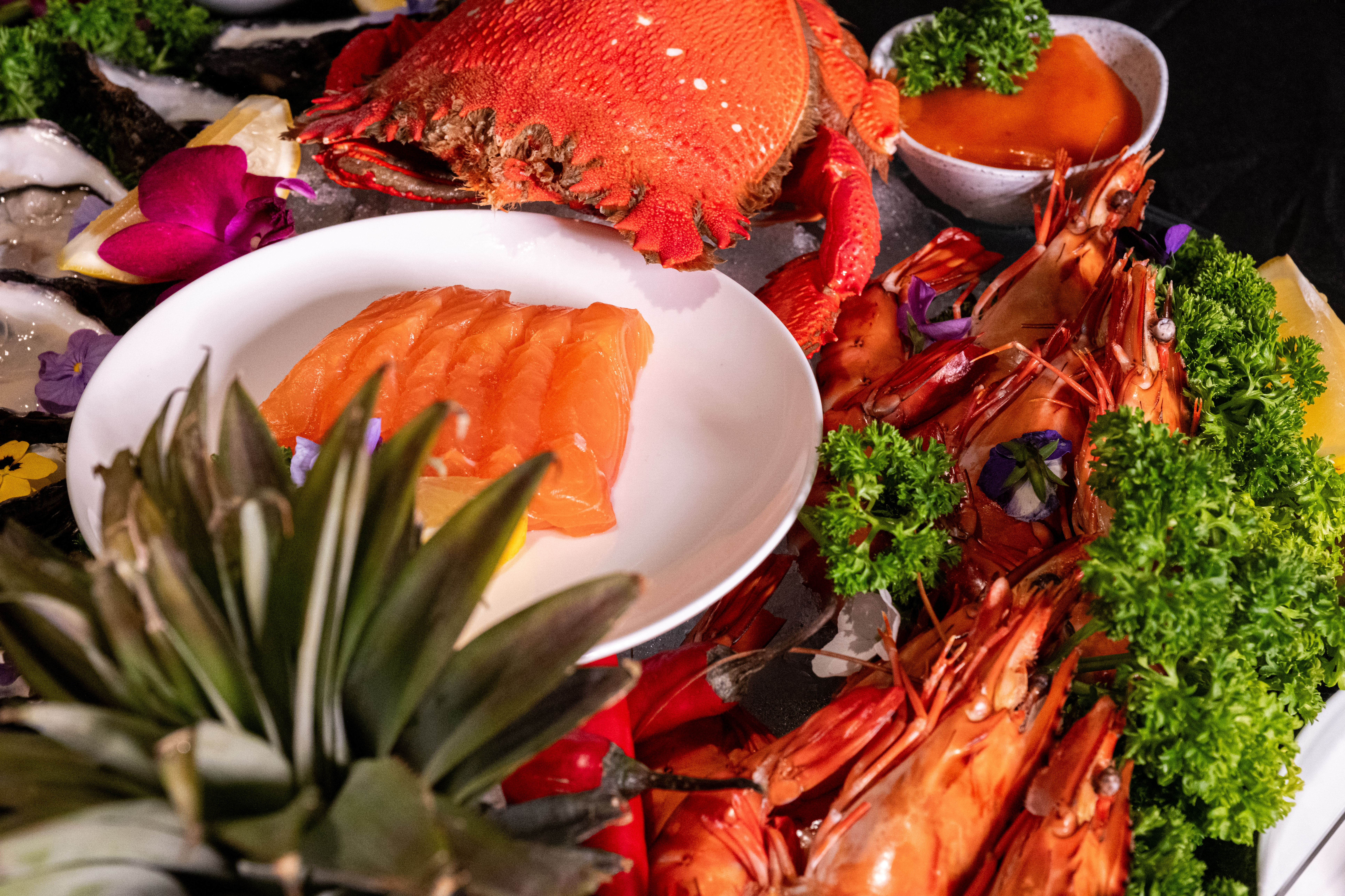 seafood buffet with crab, salmon sashimi and oysters