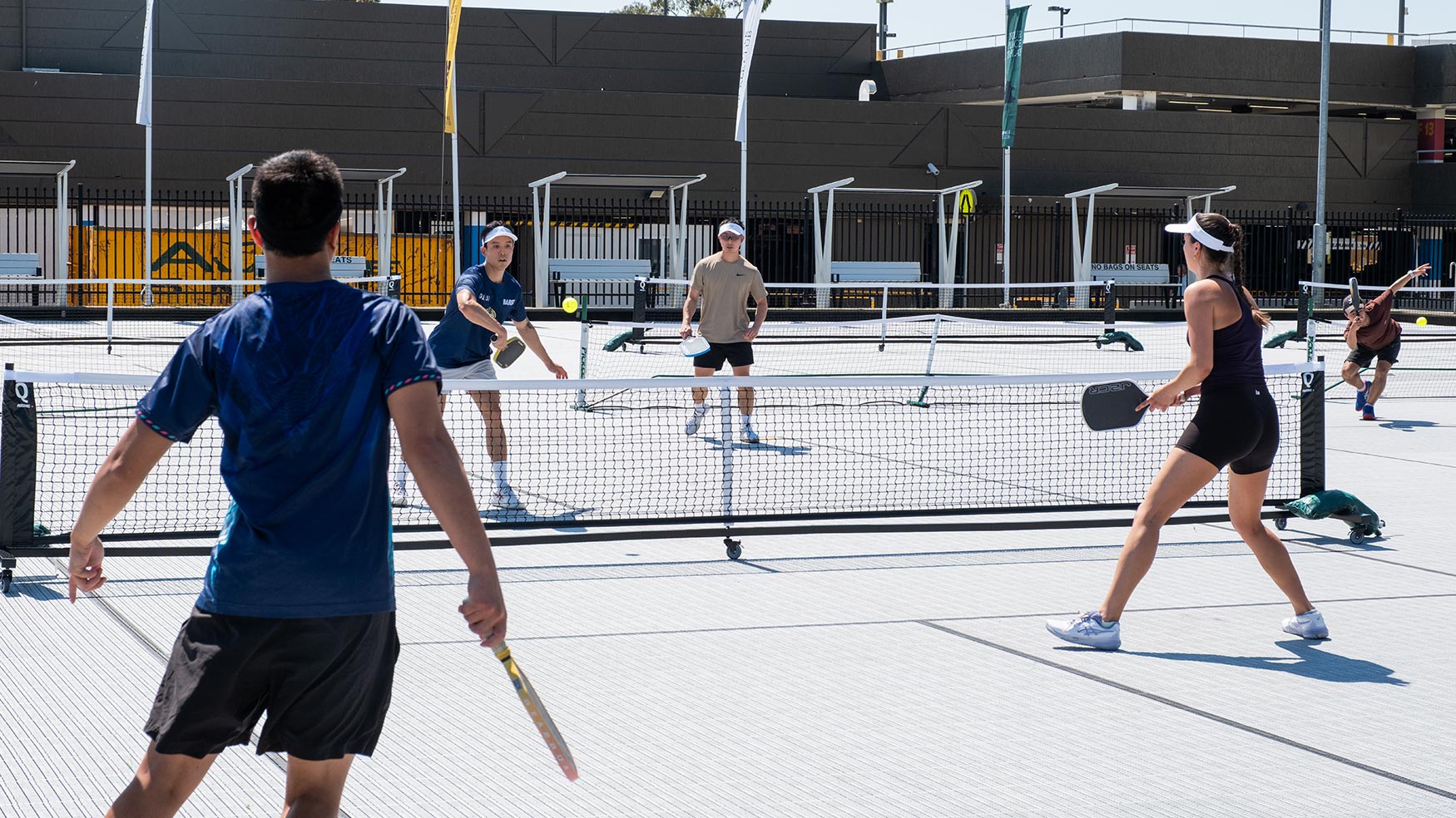 Doubles pickleball match underway on the outdoor courts at Cabravale Pickleball