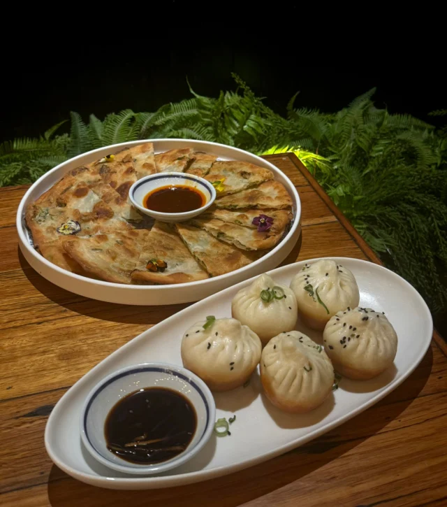 Golden pan-fried pork buns. Crispy, flaky scallion pancakes.

The kind of street-style comfort that always hits the spot.

Perfect to share… or not 😉

#cabramatta #yourlocalclub #yourlocalclubnsw #canleyvale #District8 #cabravaleclubresort #foodie #asianflavours  #AsianEats #StreetFoodVibes #DumplingLove #dumplings